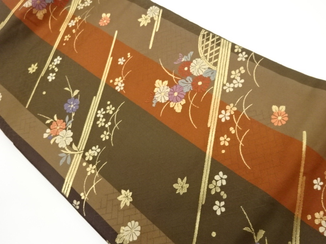 Nagoya obi woven with chrysanthemum, cherry blossom, and maple leaf patterns on